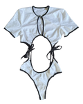 White two piece set with black accent trim and rhinestone buckles on a white background