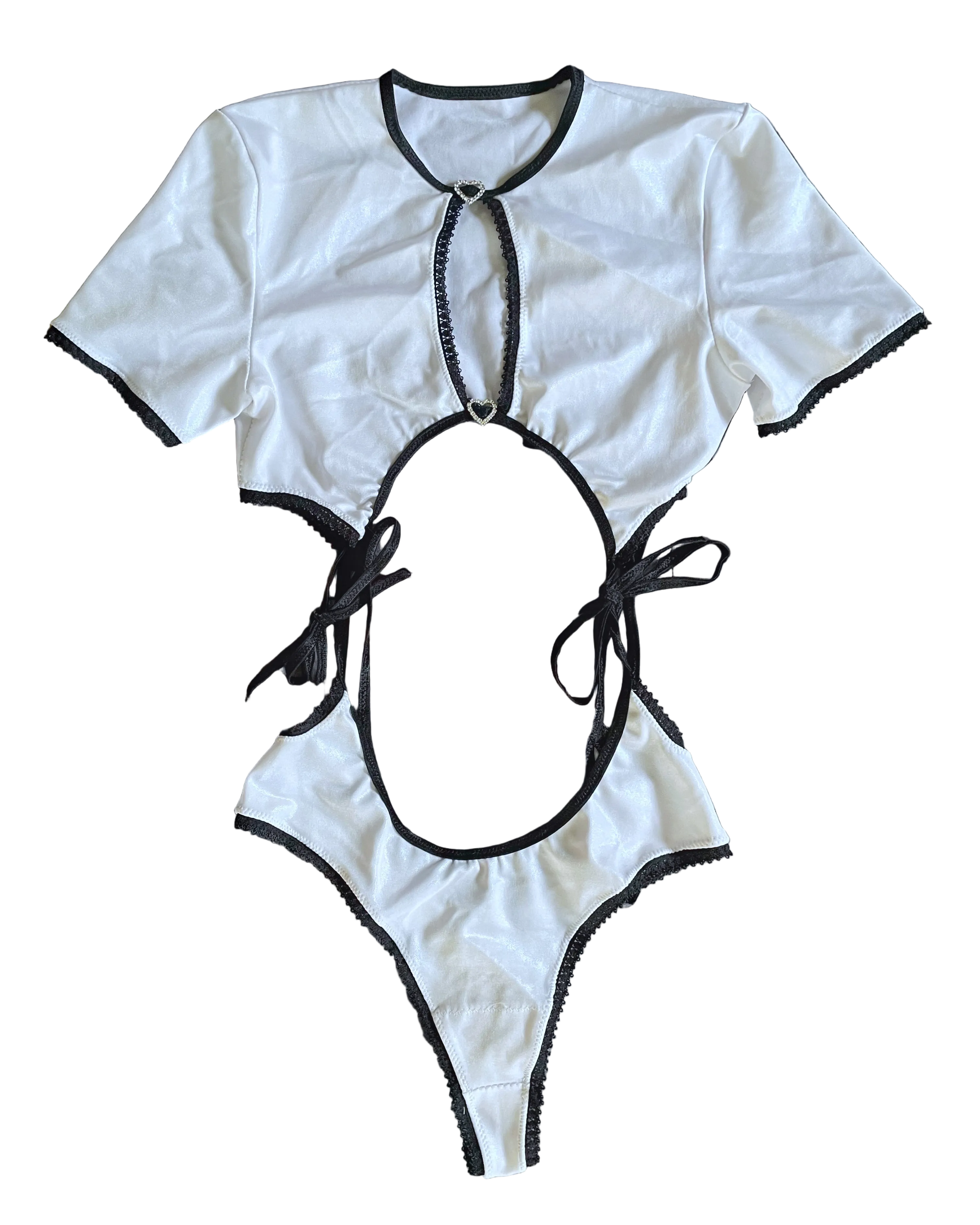 White two piece set with black accent trim and rhinestone buckles on a white background