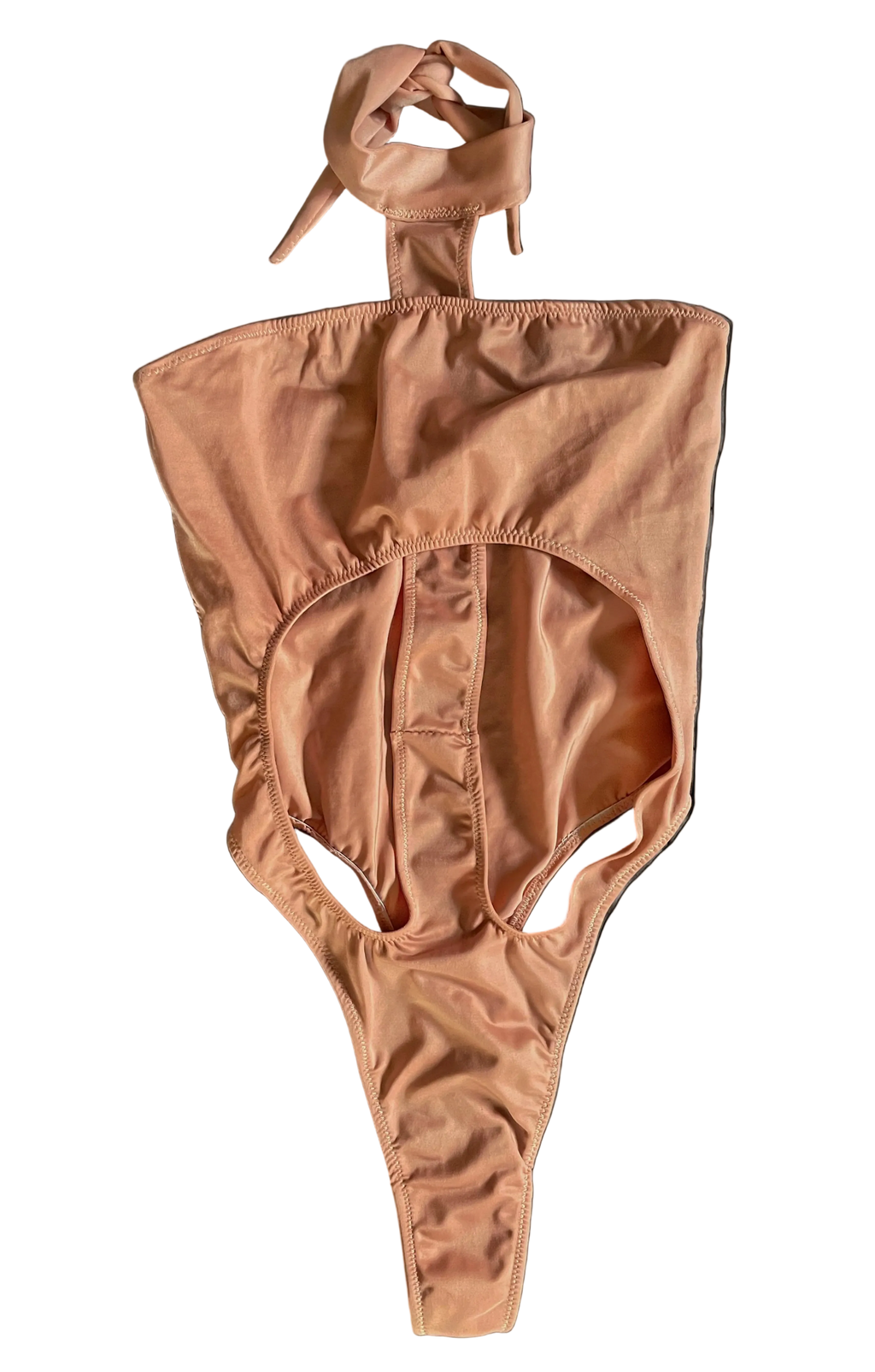 Front of apricot pink monokini with a halter neck design on a white background