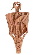 Front of apricot pink monokini with a halter neck design on a white background