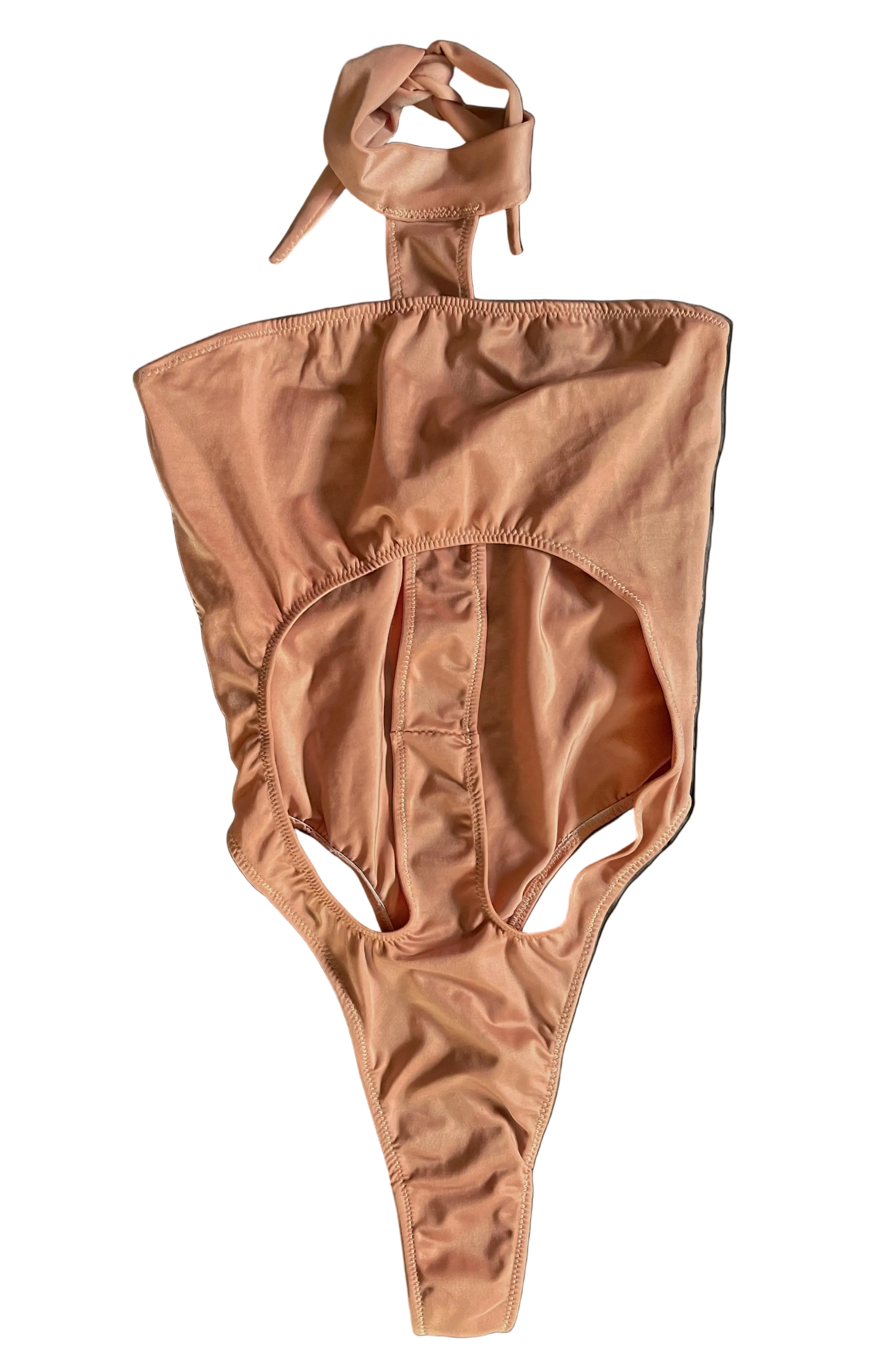 Front of apricot pink monokini with a halter neck design on a white background