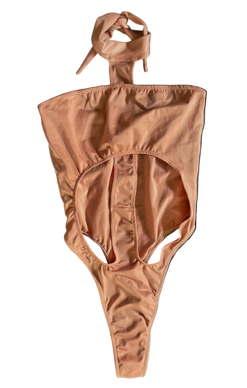 Front of apricot pink monokini with a halter neck design on a white background